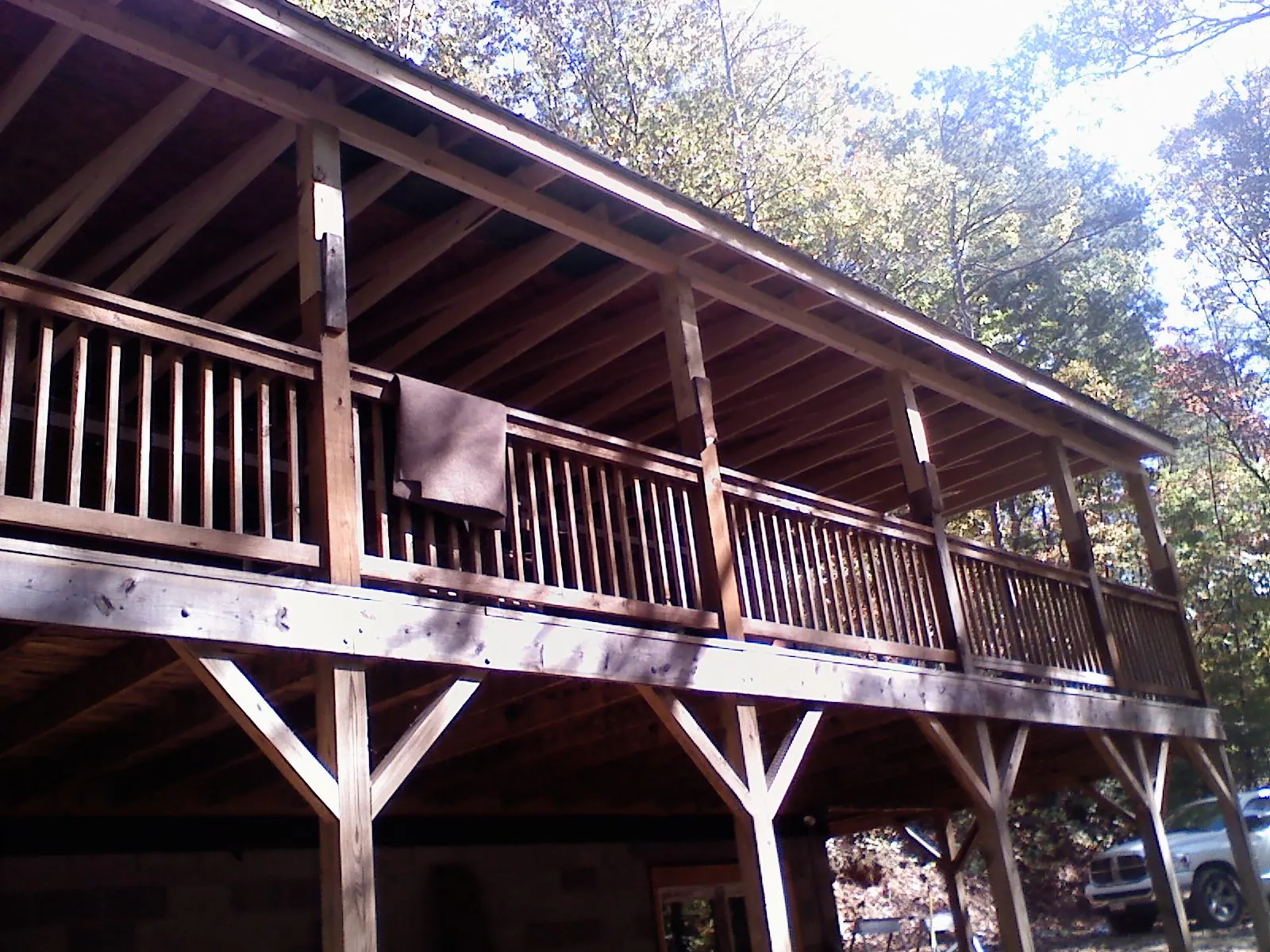 Timber framing under a new elevated porch and deck — Roof Leak Repair in Biddeford by Roofing Brothers